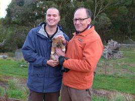 PhotoID:13711, Dr Bradley Smith and University of Florida professor Clive Wynne with a dingo puppy