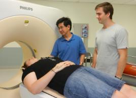 PhotoID:12145, Dr Victor Zhou describes his research to students Katrina Ryan and Josh Field