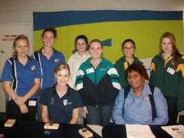PhotoID:14900, CQUniversity's second-year Mechanical Engineering student Chantel Selmanovic (seated, left) with Arrow Energy Community Officer for Gladstone Melena McKeown (seated, right) and high school students at the event.  