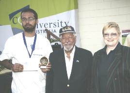 PhotoID:6156, Player of the series Rohit Ashat is congratulated by International Cultural Advisor for Sydney and Melbourne campuses Dr Martand Joshi and Deputy Vice-Chancellor Professor Angela Delves