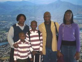 PhotoID:8582, Dr Jerome Egwurube with his wife Comfort and children