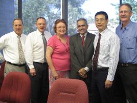 PhotoID:9613, Dr Al-Kubaisy (grey suit) with CQUniversity academics Professor Kevin Tickle, Professor Ken Hawkins, Kathy Ramm, Professor Qing-Long Han and Professor Kerry Walsh