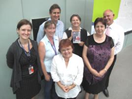 PhotoID:8113, Belinda proudly displays the new DVD, with project supporters at the launch  L-R Dr Lynne Steele, Wendy Hoey, Matthew Johnson, Professor Happell, Professor Bowman and Colette Le Page (front)