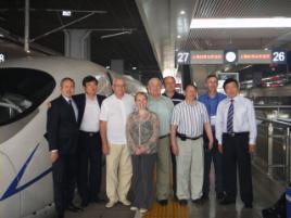 PhotoID:10933, Professor Colin Cole (second from right) views the High Speed Train at Shanghai during his recent visit to China