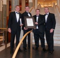 PhotoID:13644, Glenn Schumacher, GM NRG Gladstone Operations is pictured (third from left) accepting the award in Canberra