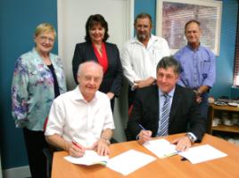 PhotoID:6504, Professor Rickard and John Downie sign the MOU in the presence of (L-R) Professor Angela Delves, Professor Jennelle Kyd, GPNL rep Bill Stacey and Dr Col Greensill 