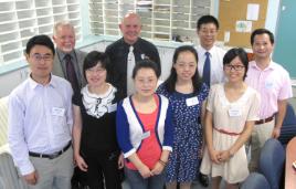 PhotoID:13918, The visiting scholars (foreground) are welcomed by L-R Professor Graham Pegg, Professor Scott Bowman and Professor Qing-Long Han