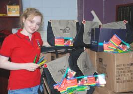 PhotoID:5406, Student mentor Ana Stevenson looks over just some of the giveaways new students will receive during this week's Orientation Week at CQU Rockhampton. 