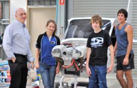 PhotoID:9209, Head of CQUniversity's Aviation Program Ron Bishop immerses high school students Emma Cherry and Jonathan Ward in the world of aviation.