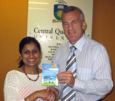 PhotoID:5284, Rachita Garg thought an excursion along the Great Ocean Road, Philip Island or the Dandenong Mountains were good ideas to get students more involved in social events. She was presented with her competition prize by Assoc. Professor Ken Bruce.