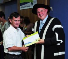 PhotoID:10714, Steven Roberts accepts his STEPS completion certificate in late 2010. Photo courtesy Craig Chapman Photography