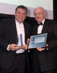 PhotoID:5910, Vice-Chancellor Professor John Rickard presents the award to Community Employment Options CEO Peter Callaghan.