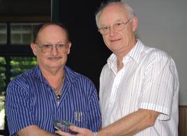 PhotoID:5254, Dr Wally Woods receives his 35-year service plaque from Professor Rickard.