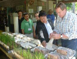 PhotoID:13399, Daryl Young (AACT) and Cang Fenghua from New Margin Ventures discuss CQUniversity's agricultural facilities and programs with Dr Surya Bhattarai