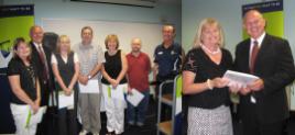 PhotoID:8138, The VC congratulates long-servers (from left) Kim Gohdes, Kerry Comollattie, Peter Lawrence, Janet West, Jaron Stidiford, Mark Kennedy and Karen Reynolds