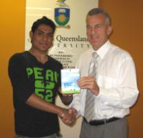 PhotoID:5282, Victorian State Director Associate Professor Ken Bruce presents Mir Arif Ali with his competition prize. 