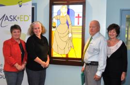 PhotoID:12381, Retired doctor Tom Dewar shows his artwork to CQUniversity Nursing academics L-R Assoc Prof Kerry Reid-Searl, Justine Connor and Julie Bradshaw