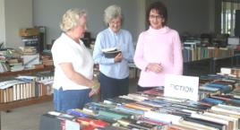 PhotoID:9367, Library Society booksale volunteers Jenny Gibson, Jean Verdon and Library Manager Pauline McNee plan their annual book sale