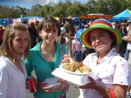 PhotoID:4499, Brooke Shannen, Caroline Mcdmore and Rocio Mcdmore enjoy the multicultural tastes of the Fair last year.