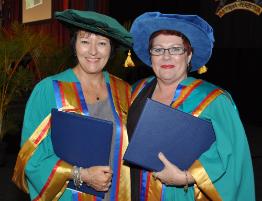 PhotoID:10534, Julie Willans (left) accepted a Doctor of Education degree based on her thesis about navigating personal change, while Leone Hinton gained her Professional Doctorate for studying academics engaging in evaluation practices