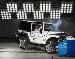 PhotoID:13628, The Jeep pictured during its frontal offset crash test at 64 km/h