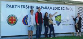 PhotoID:12692, (L-R) Cairns-based paramedic students Yanick, Matt, Emma and Lindsay pictured with Communications Centre Supervisor Angela Timmins