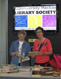 PhotoID:9075, Mary Novikov  (Committee member-Library Society) and Jocelyn Wood (President of Library Society) prepare the books for the sale.