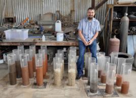 PhotoID:14713, Wastewater researcher Ben Kele is on the agenda for the Gladstone event. He's pictured showing volcanic rocks used in filtration systems