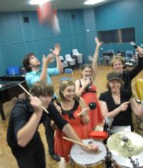 PhotoID:13133, Students during a break in rehearsals for their concert with Gustavo Cereijo. Front L -R:  Tom Kirchner, Shanice Andersen, Natalie Gray Back L- R: Max Slater, Amelia Kase, Ben Harper