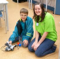 PhotoID:9533, CQUniversity's Theresa Larcombe shows Ral leBoydre-Pershouse how to use robotics in Bundaberg.