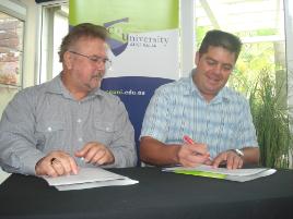 PhotoID:8670, Geoff Fleming and Dr Viljoen signing the agreement