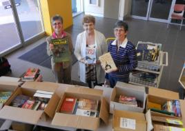 PhotoID:14986, CQUniversity Library Society members Helen Page, Dawn Eastwell and Jocelyn Wood sort out the huge variety of books on offer. 