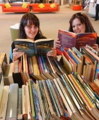 PhotoID:12929, CQUni Mackay students Helena Reitano and Teel Wade explore the books that will be on sale at the CQUniversity Mackay 2012 Open Day on Sunday. 