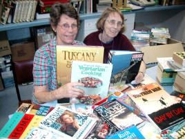 PhotoID:5848, Library Society members Robin McWhinney, left, and Clare Davis prepare donated books for the Central Queensland University Annual Library Book Sale