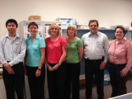 PhotoID:6580, Mackay Base Hospital staff Dr Kyaw San, Theresa Morgan, Maude Chapman, Simone Talbot and visiting guests Kevin O'Brien (Sanofi-Aventis) and Renae Collins (PA Hospital)