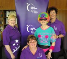 PhotoID:5508, CQU Deputy Vice-Chancellor Angela Delves lends encouragement to Relay promoters Ros Bedward (committee chair), Esther Black (from the Cheeky Cheerleaders team) and Gail Imhoff (project officer)