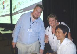 PhotoID:8305, Peter Carlsen (Bundaberg Campus) and Louise Hayes (Rockhampton Campus) meet up with Li Cunxin of 'Mao's Last Dancer' fame