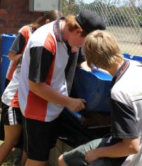 PhotoID:11741, Students fitting the hose that connects the grow beds to the yabby pond