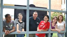 PhotoID:6905, L-R are Ricardo Lopes and Lisa Eising from Rockhampton campus, welcoming Rodney Mayfield and Donna Philip from Bundaberg and Katrina Hurst and Tania Screen from Mackay