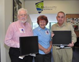 PhotoID:14499, Radio 4YOU President Doug Gambling, Secretary Karin Stokes and committee member Greg Ahchay gathered at Rockhampton Campus recently to receive the computers.