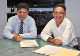 PhotoID:14330, Rotary Club of Rockhampton President Neil Malick and Professor Kevin Ronan sign the agreement