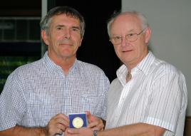 PhotoID:5253, Professor Rickard presents David Oliver with his 25-year service medal.