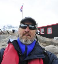 PhotoID:13933, Prof Bauer at the former British Base A at Port Lockroy - now the most visited site in Antarctica with 15,000 tourists per season (Photo credit: Thomas Bauer). 