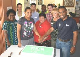 PhotoID:6887, Helping Ros Dunphy cut the TEP cake are Robina and Malcolm Mann