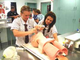 PhotoID:9976, Brooke Andrews and Lauren Rixon have a go at intubating a mannequin.