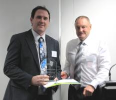 PhotoID:10557, Daniel Abell from Brisbane receives his trophy from Professor Ken Hawkins