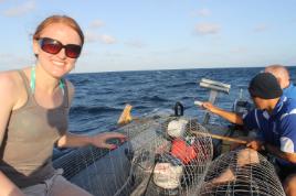 PhotoID:13463, Rachel out on the boat with her collecting equipment