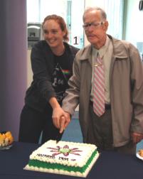 PhotoID:12502, Cyril Golding helps CQUni student Courtney Stewart cut the cake