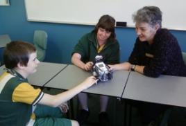 PhotoID:9532, Sam Williams teaches students from Gin Gin using robotics.