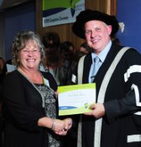 PhotoID:9840, Tracey Weber-Hansen accepts her certificate. Photo courtesy Craig Chapman Photography